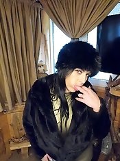 Giving a deep blow job while dressed in a fur coat and shiny boots 204.